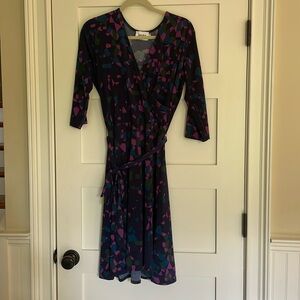 Leota faux wrap dress with self belt.
